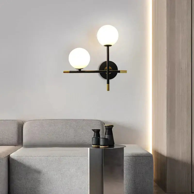 Modern black and brass DecorBites LED glass ball wall lamp with two frosted glass shades for living bedroom lighting