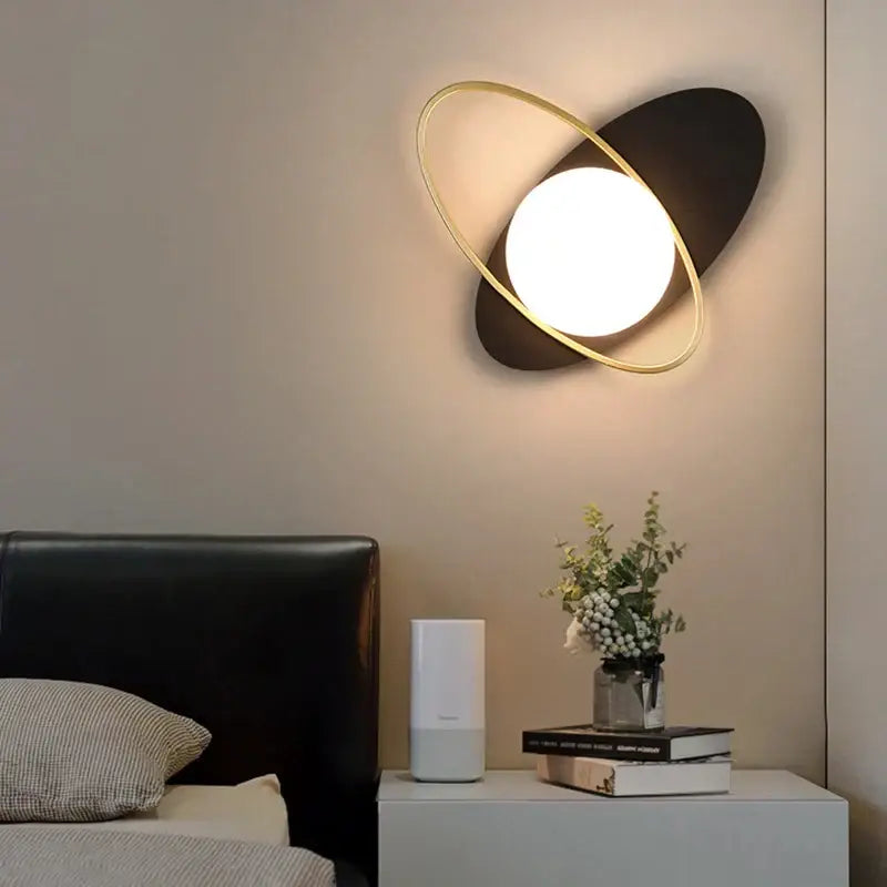 Modern black and gold decorbites led glass ball wall sconce with glowing circular light for bedroom and living room