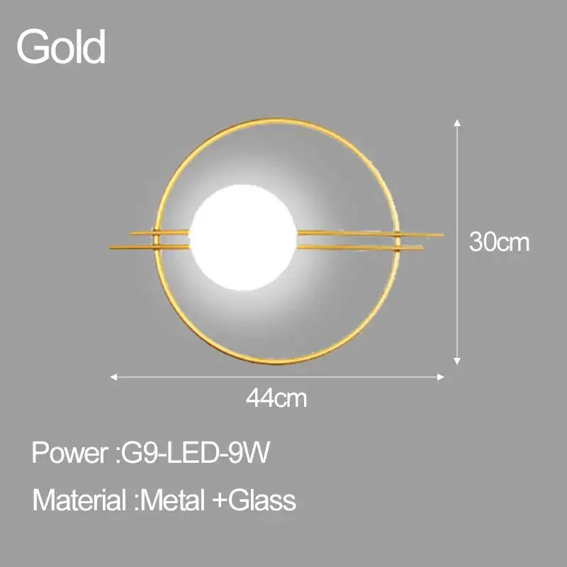 Gold circular wall sconce with central illuminated glass ball and metal frame decorbites led glass for bedroom living room