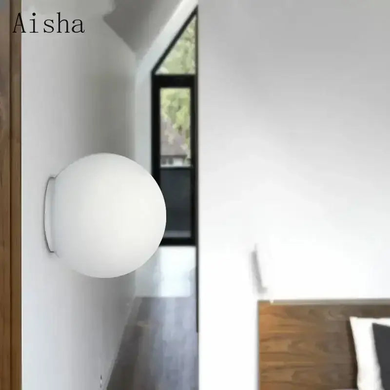 A sleek matte white decorbites led glass ball wall sconce light with minimalist design in 14cm size