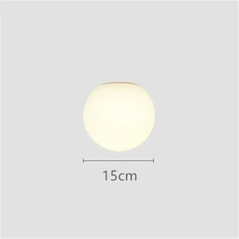 A sleek decorbites led glass ball wall sconce 15cm diameter with matte finish and soft diffused white glow
