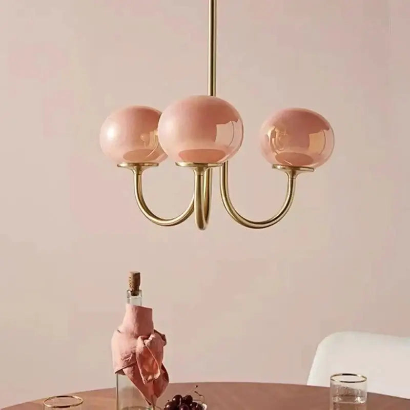 Decorbites led glass three-arm chandelier with rose-tinted glass balls and polished brass finish for home decor