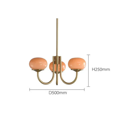 A modern decorbites led glass three-arm chandelier with brass finish and peach glass balls chandeliers for home decor