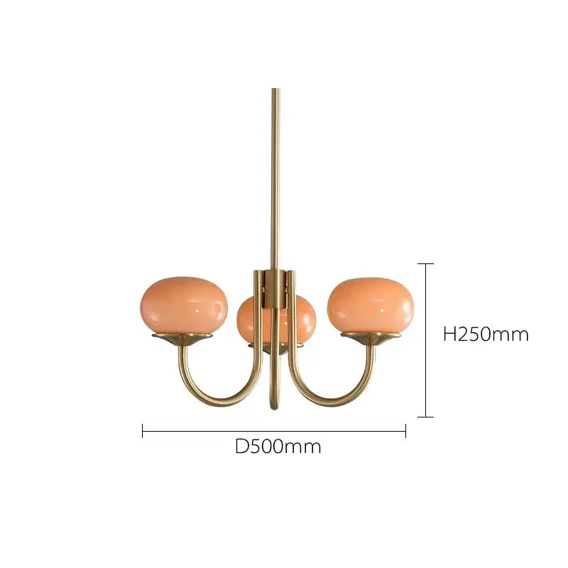 A modern decorbites led glass three-arm chandelier with brass finish and peach glass balls chandeliers for home decor