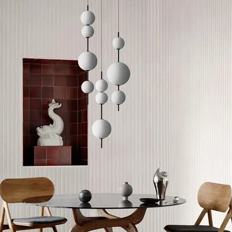 Modern white spherical decorbites led glass beads pendant chandelier with varying sizes and smooth matte finishes