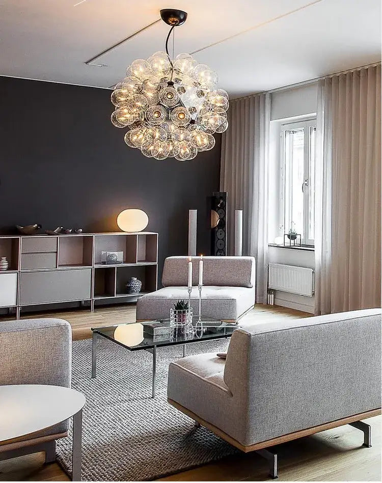 A modern DecorBites LED glass bubble chandelier with clear glass orbs in gold, chrome, and black finishes