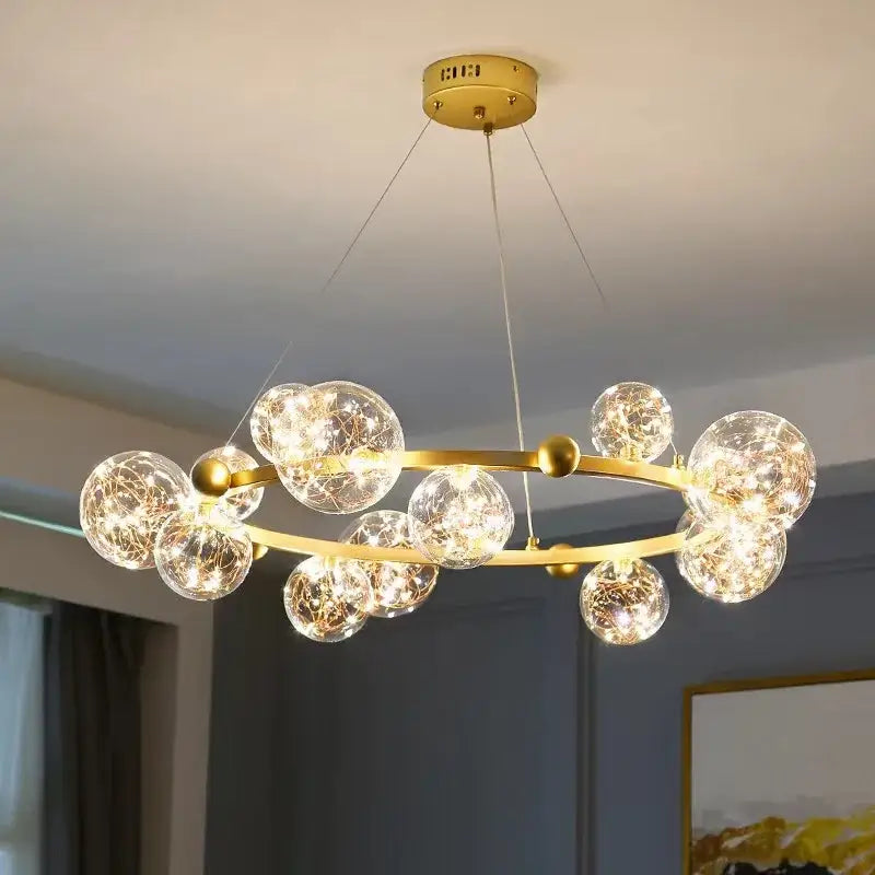 Gold-toned decorbites led glass pendant light with clear glass spheres and gypsophila string glowing fairy lights