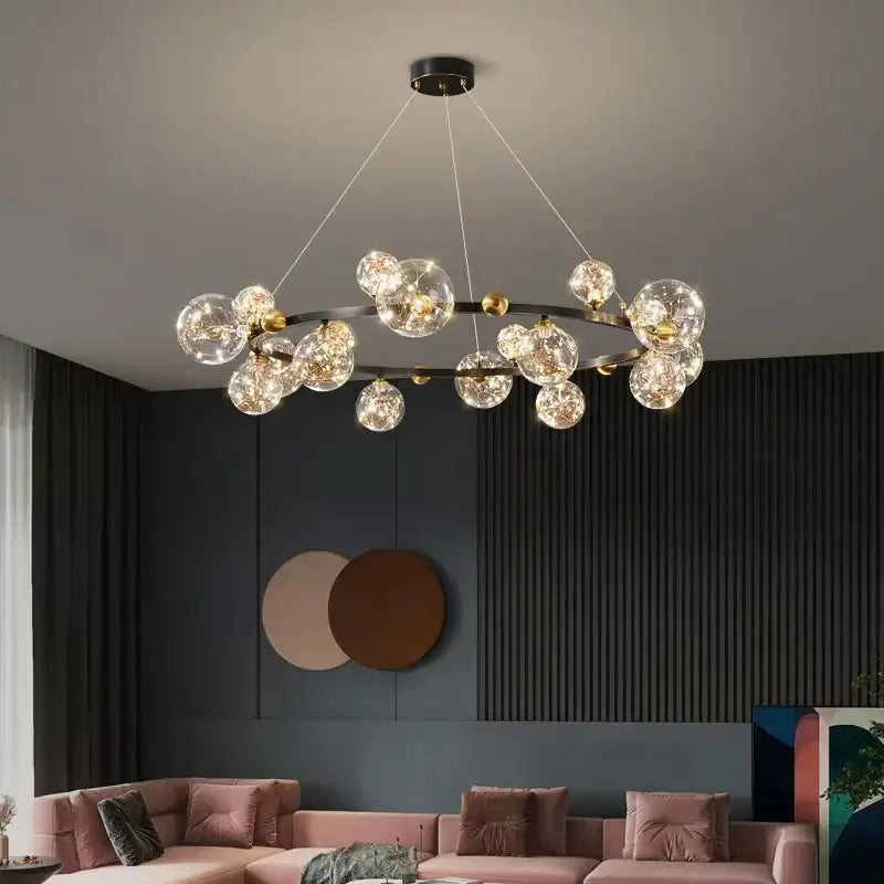 Modern pendant light featuring decorbites led glass bulb with circular gold and black frame and clear globes