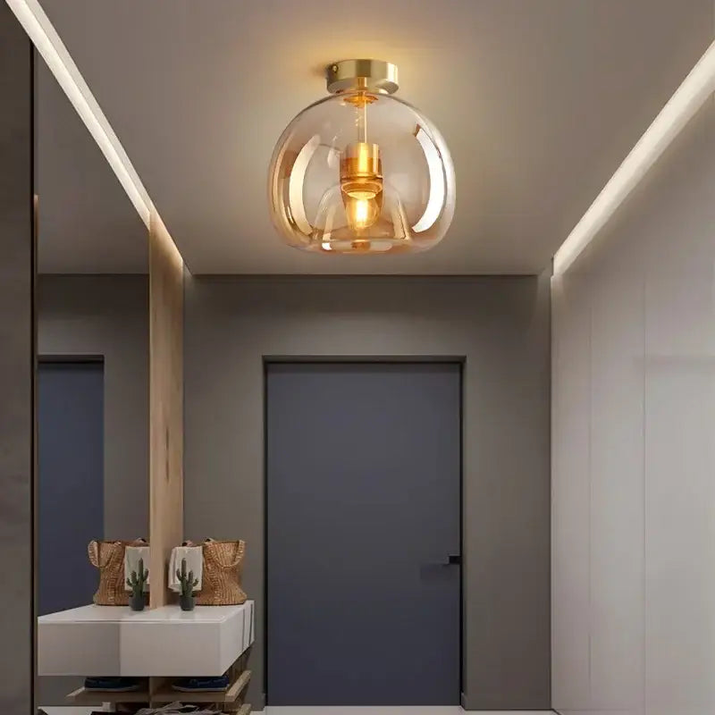 DecorBites led glass ceiling chandeliers featuring a modern brass finish globe light with warm ambient glow for indoor use