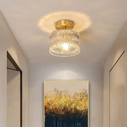 DecorBites led glass ceiling lamp with gold-toned metal base and clear textured glass shade diffusing warm light