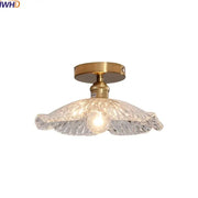 DecorBites™ LED glass ceiling lamp with brass-finished metal base and ornate textured clear glass ceiling shade