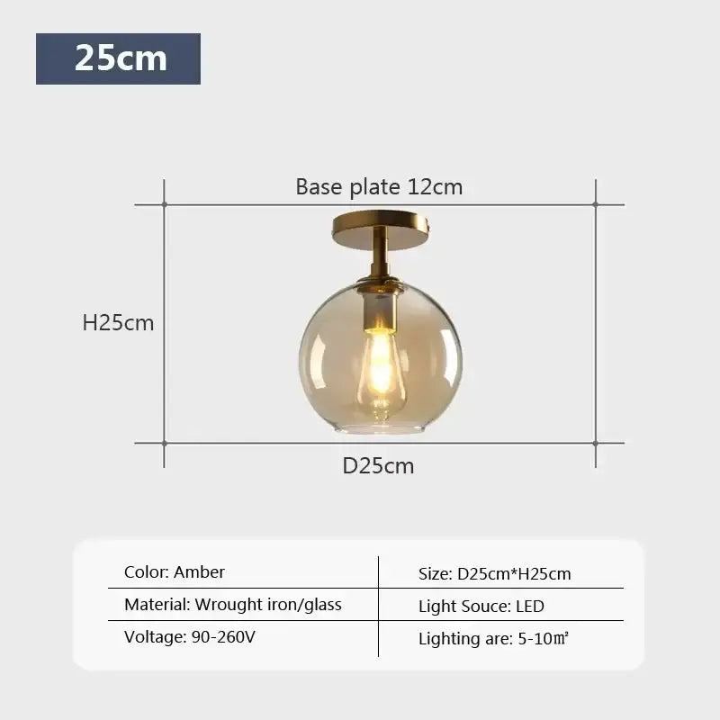 Amber-colored spherical decorbites led glass ceiling light with brass base and led bulb for modern living spaces