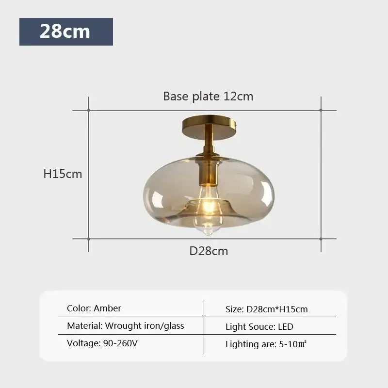 Amber-colored DecorBites LED glass ceiling light with a frosted glass globe and brass-finished wrought iron base