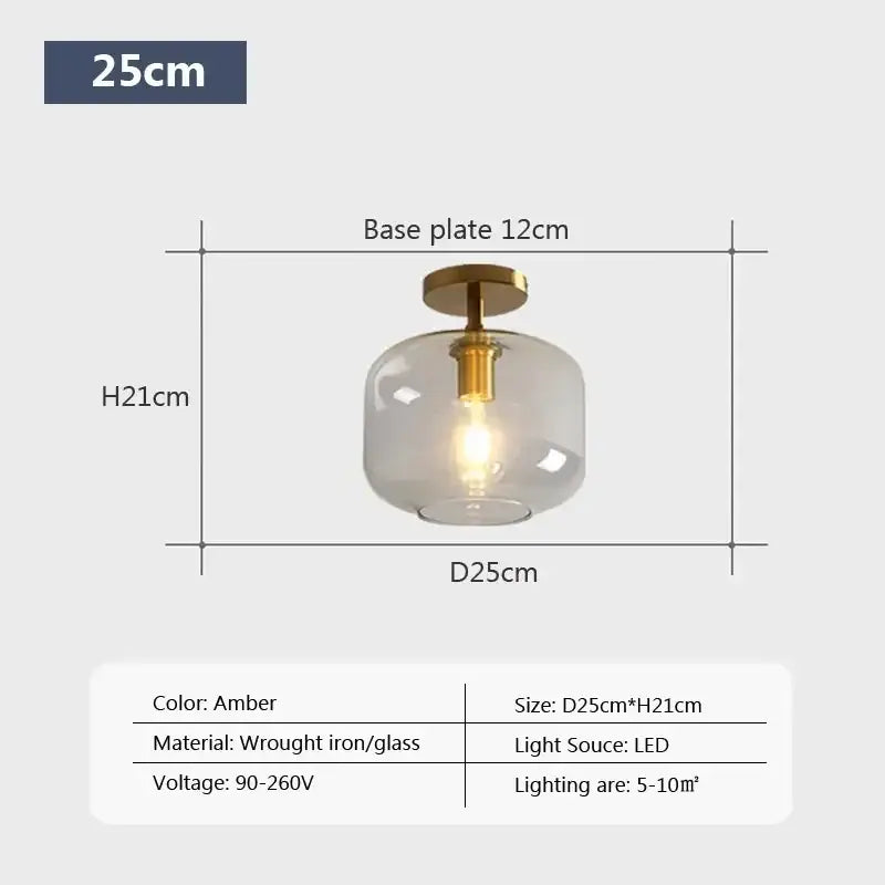 Amber-colored DecorBites™ LED glass ceiling light with frosted globe and brass-finished wrought iron base for modern spaces