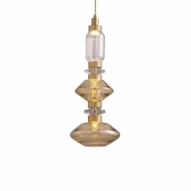 Modern decorbites led glass chandelier with clear amber glass shades and gold metal accents on adjustable wire suspension