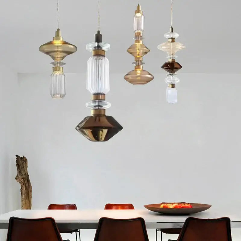 A decorbites led glass chandelier with stacked clear amber glass and brass components on adjustable wire 200cm