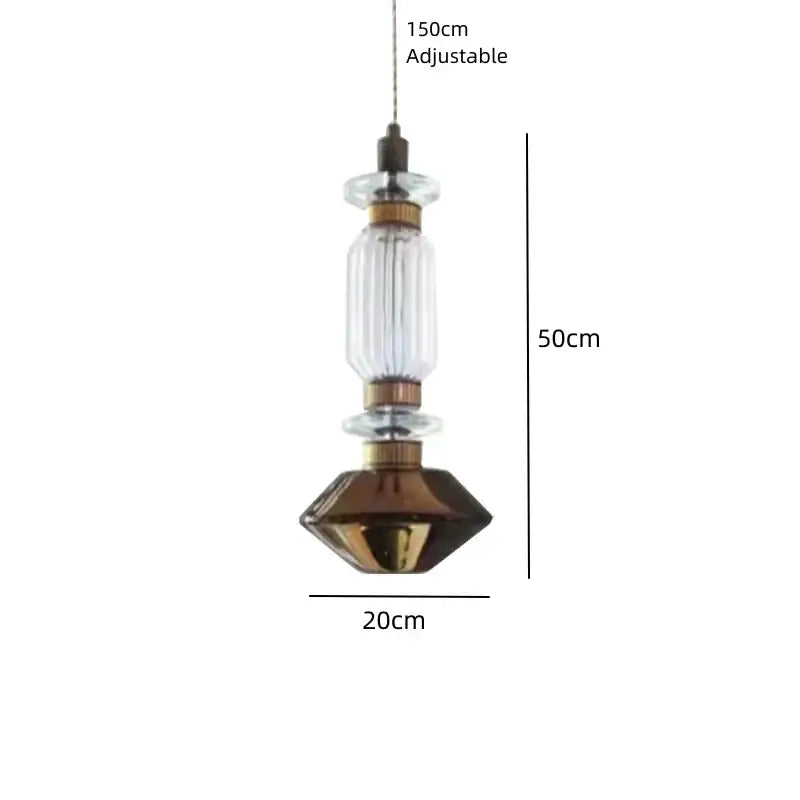 A modern decorbites led glass chandelier with clear amber ribbed cylinder and faceted bronze-colored base