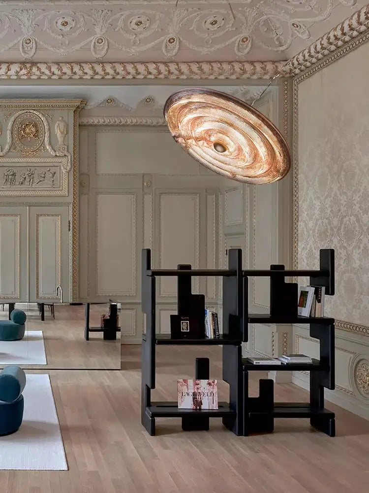 A bronze-toned circular decorbites led glass chandelier with layered concentric design for dining room ceiling