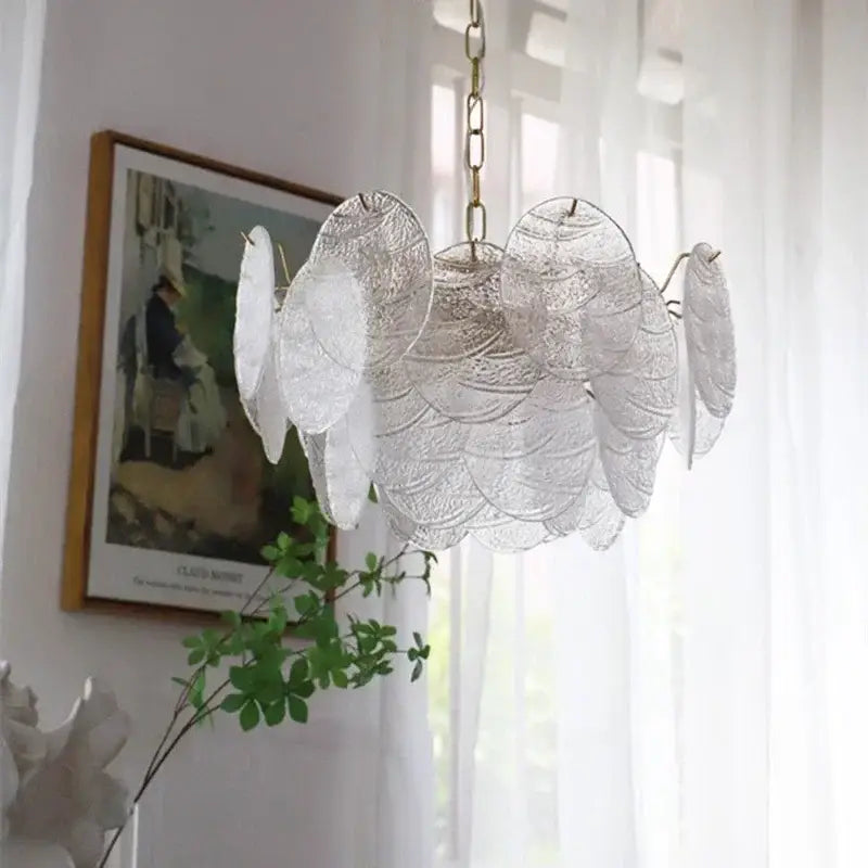 Decorbites led glass chandelier with delicate translucent glass leaves and brass chain suspension in modern minimalist design