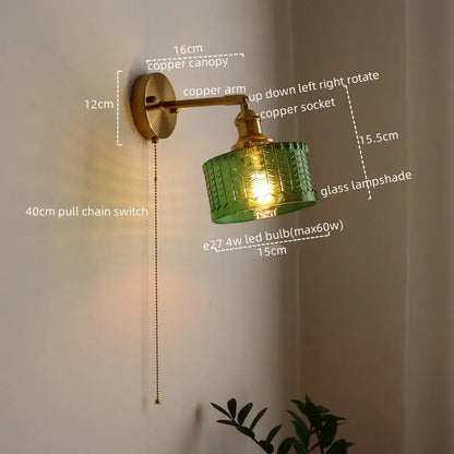 DecorBites™ green glass wall sconce with textured pattern mounted on copper arm and pull chain switch for bedroom