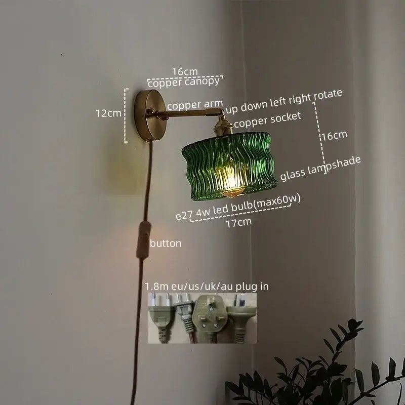 Green ribbed glass lampshade wall sconce with copper arm and canopy featuring pull chain switch for bedroom use