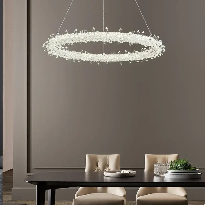 A decorbites led glass crystal chandelier featuring a modern circular ring design with clear crystal droplets in white lustre