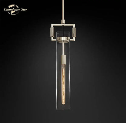 A modern pendant light with a brushed metallic frame and clear glass enclosure from decorbites led glass cylinder series