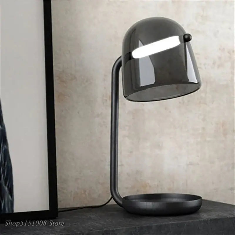 Modern matte black decorbites led glass floor lamp with curved metal base and translucent dome shade for living room lighting