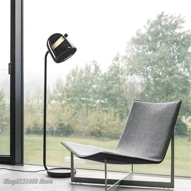 Modern black DecorBites LED glass floor lamp with sleek curved neck and gold-accented matte finish head for living rooms