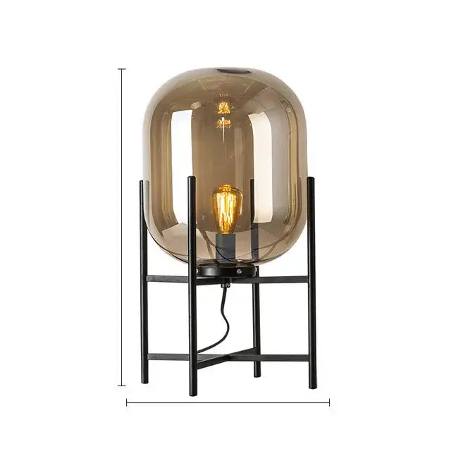 A decorbites led glass floor lamp featuring a sleek amber dome with a vintage filament bulb on a black metal stand