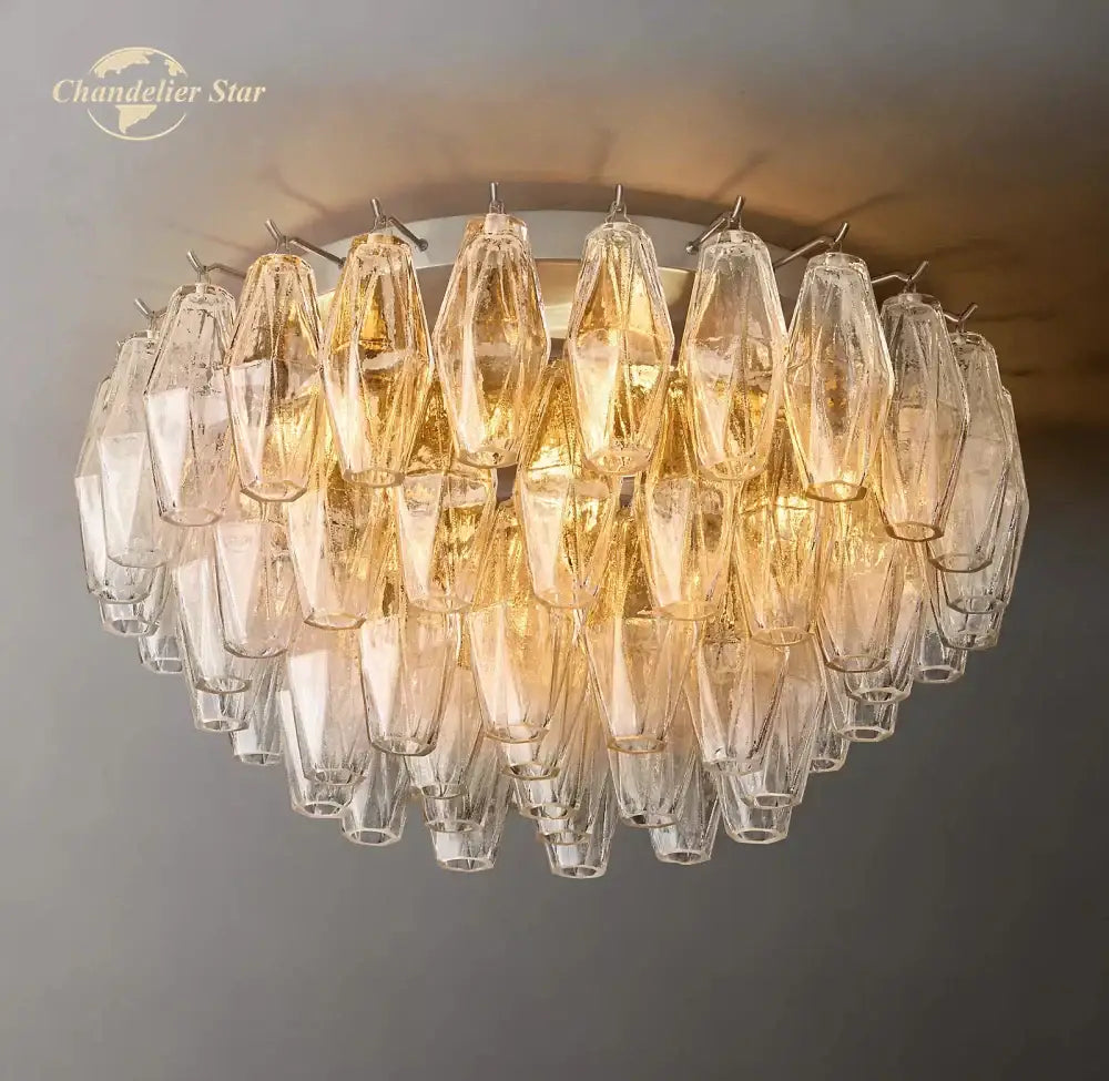 A modern brass finish decorbites led glass flushmount ceiling lamp with amber-tinted faceted glass crystals