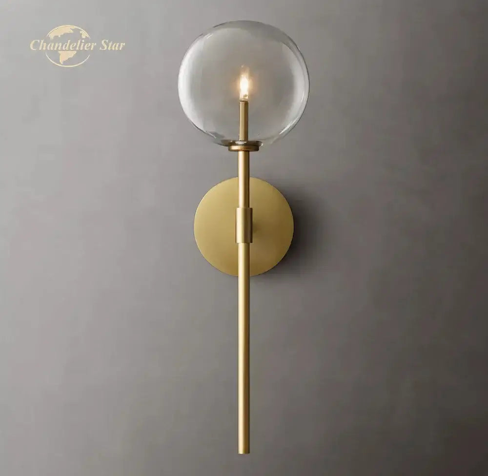 Gold-toned decorbites led glass globe wall sconce with clear glass globe and slender stem for modern indoor lighting