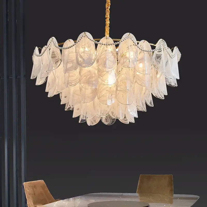 Decorbites led glass pendant light featuring a translucent layered scalloped glass shell with gold-toned chain suspension