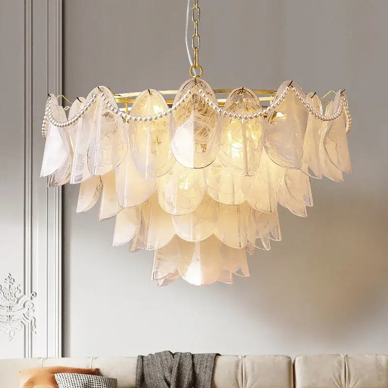 A tiered DecorBites LED glass pendant light with gold-toned frame leaf-shaped shades and pearl-like bead accents
