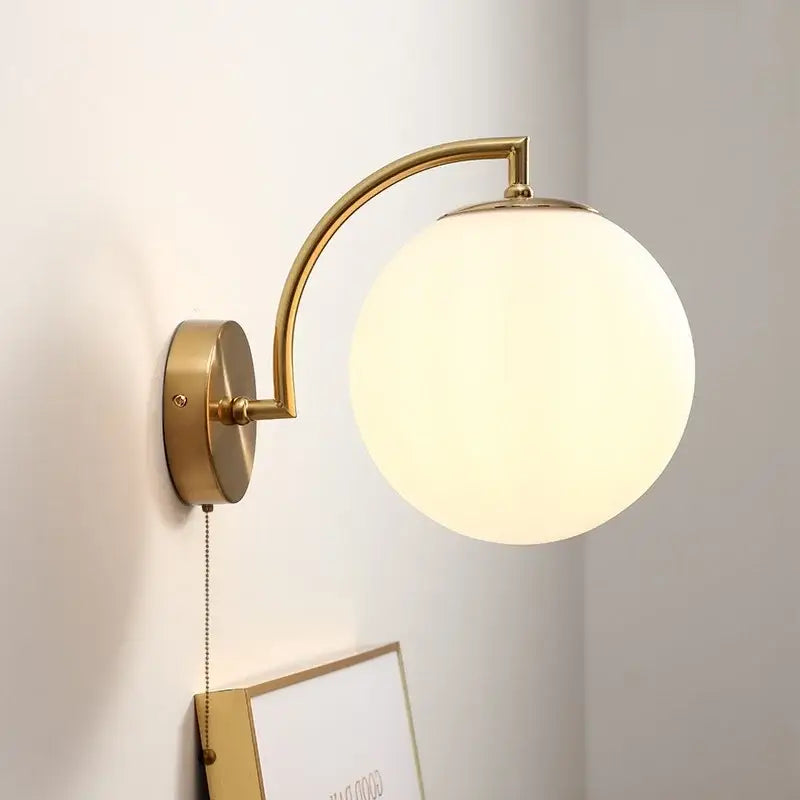 Gold-toned DecorBites LED glass iron wall light with curved arm frosted glass globe shade and pull chain switch for corridor