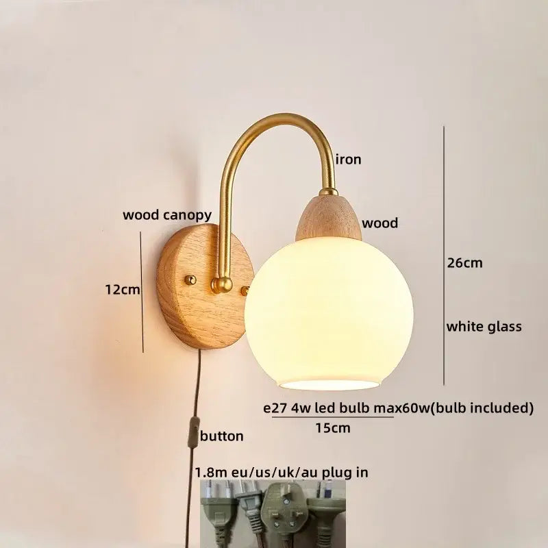 DecorBites™ warm-toned wall light fixture with brass iron arm wooden base and white glass shade for modern bedside use