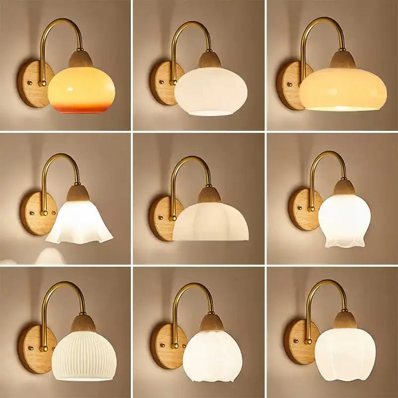 Decorbites™ warm-toned frosted glass globe wall light fixture with brass arms and wooden backplates for bedside use