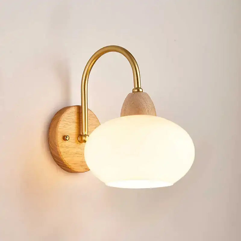 DecorBites™ warm-toned wall light fixture with brass arm wooden base and frosted glass shade modern Nordic design