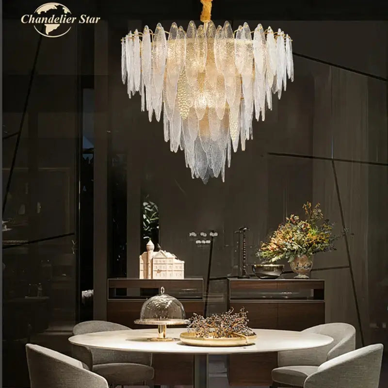 Elegant gold-toned DecorBites LED glass metal leaf chandelier with cascading translucent feather-like panels for luxury decor
