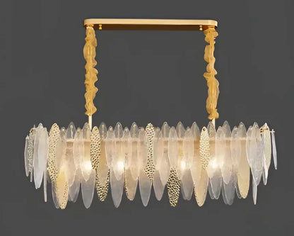 Gold-toned decorbites led glass metal leaf chandelier with cascading translucent leaves and ornate textured chains for luxury decor