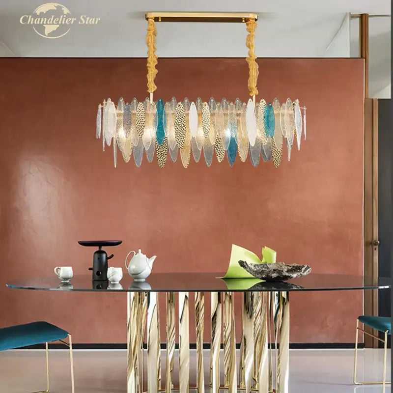 A decorbites led glass metal chandelier with gold frame and layered translucent white teal glass metal leaf plates for home decor