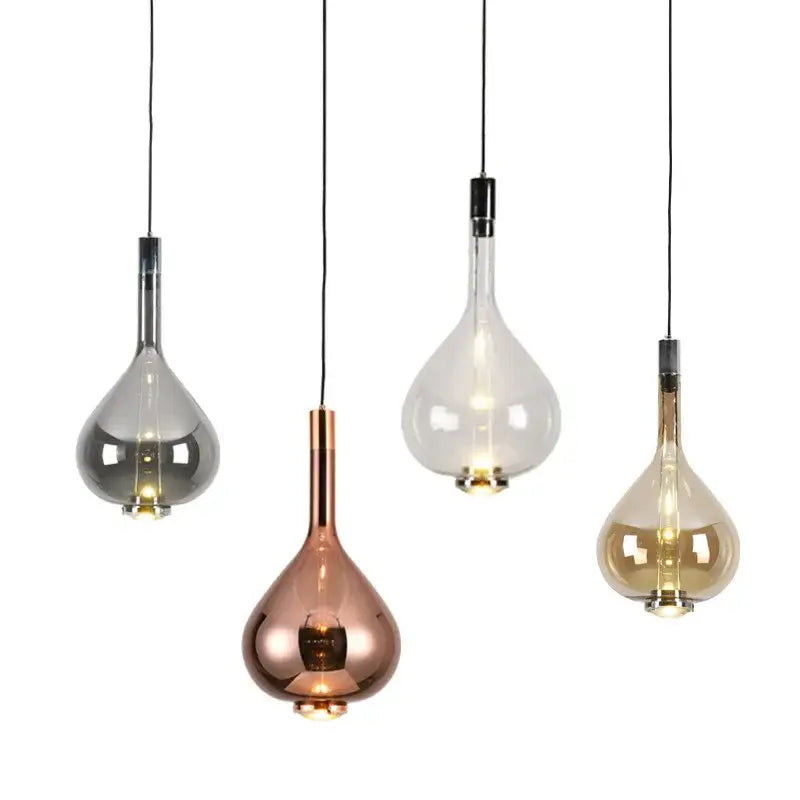 Four metallic teardrop pendant chandelier lights in silver rose gold and clear glass with black cords decorbites led glass