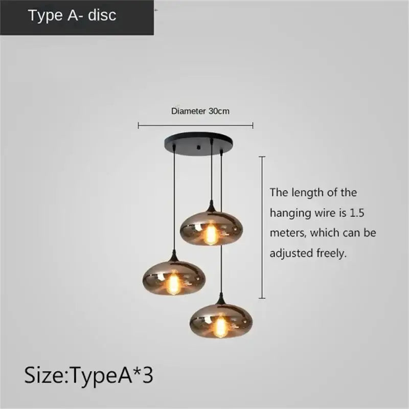 Set of three modern DecorBites LED glass pendant chandelier lights with smoked glass discs and black metal fixtures