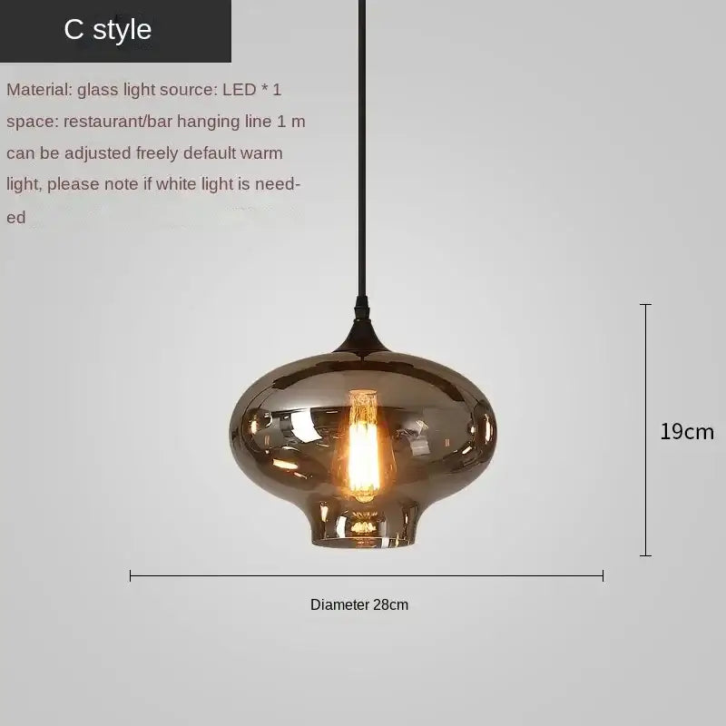 A sleek amber-tinted decorbites led glass pendant chandelier with a warm led bulb for kitchen dining bar décor