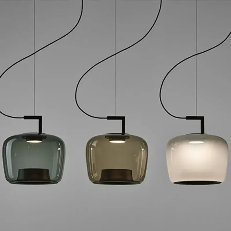 Three modern DecorBites LED glass pendant chandelier with muted green amber and frosted white shades for dining use