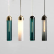 Four cylindrical decorbites led glass pendant lights with brass caps in teal white dark green and smoked gray for chandelier