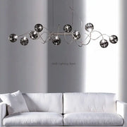 Modern chrome-finished decorbites led glass pendant chandelier with reflective spherical bulbs for living room and dining use