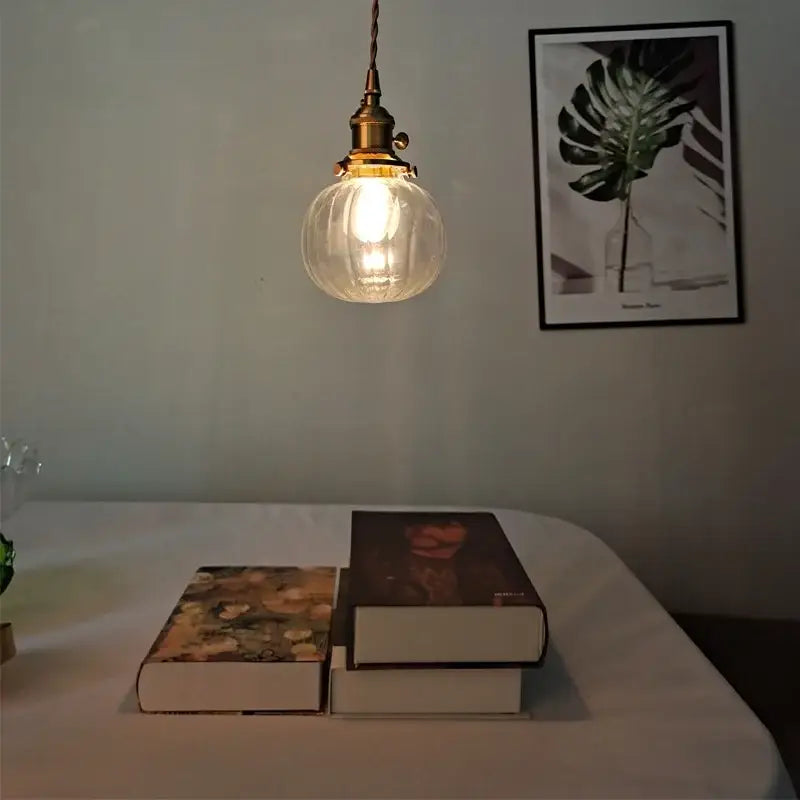 Decorbites™ warm-toned brass pendant light fixture with clear textured glass globe for study restaurant kitchen use