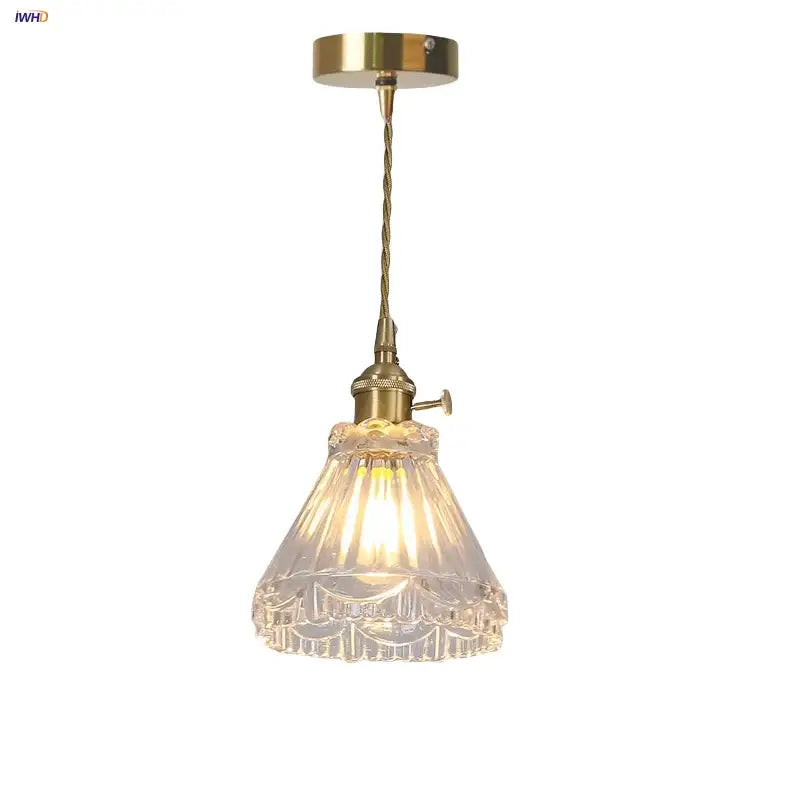 Vintage-style brass pendant light with clear faceted glass shade featuring intricate cut patterns in decorbites led glass design