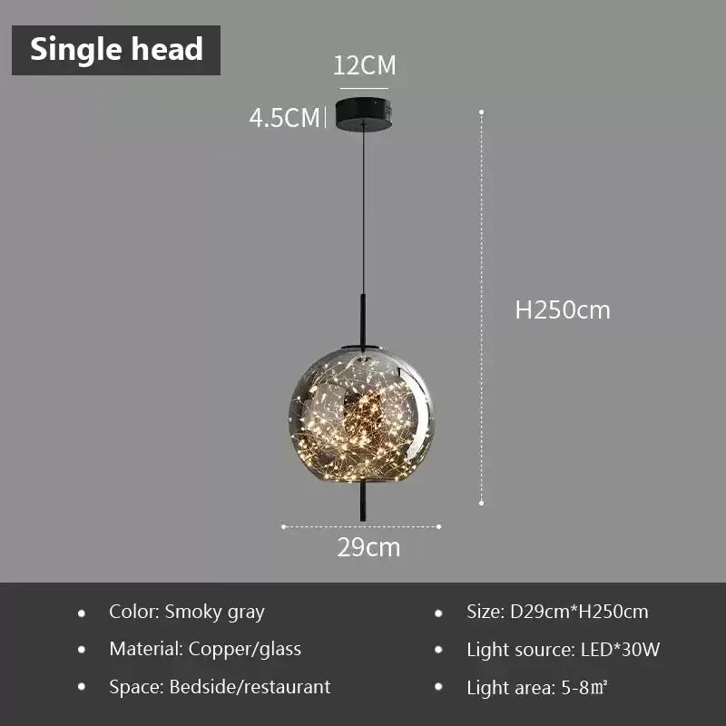 Smokey gray decorbites led glass pendant light with copper and glass featuring illuminated golden filaments inside globe
